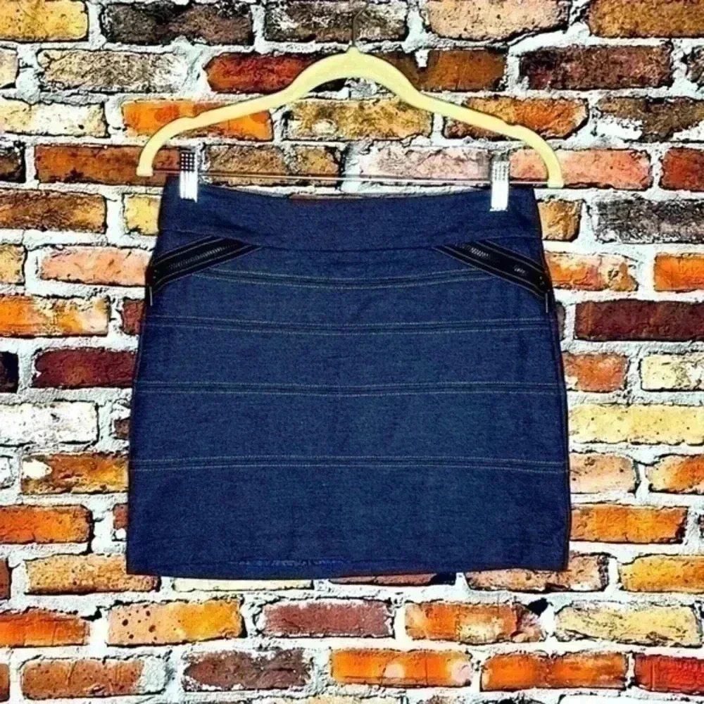 BCBGeneration denim mini skirt with horizontal seams and zipper details.  Size 4